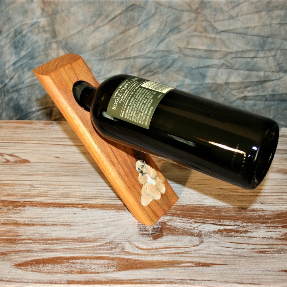 Wooden gravity defying wine holder